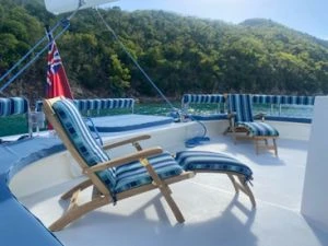 Goldenteak Teak Steamer Chair on Charter Boat in Caribbean